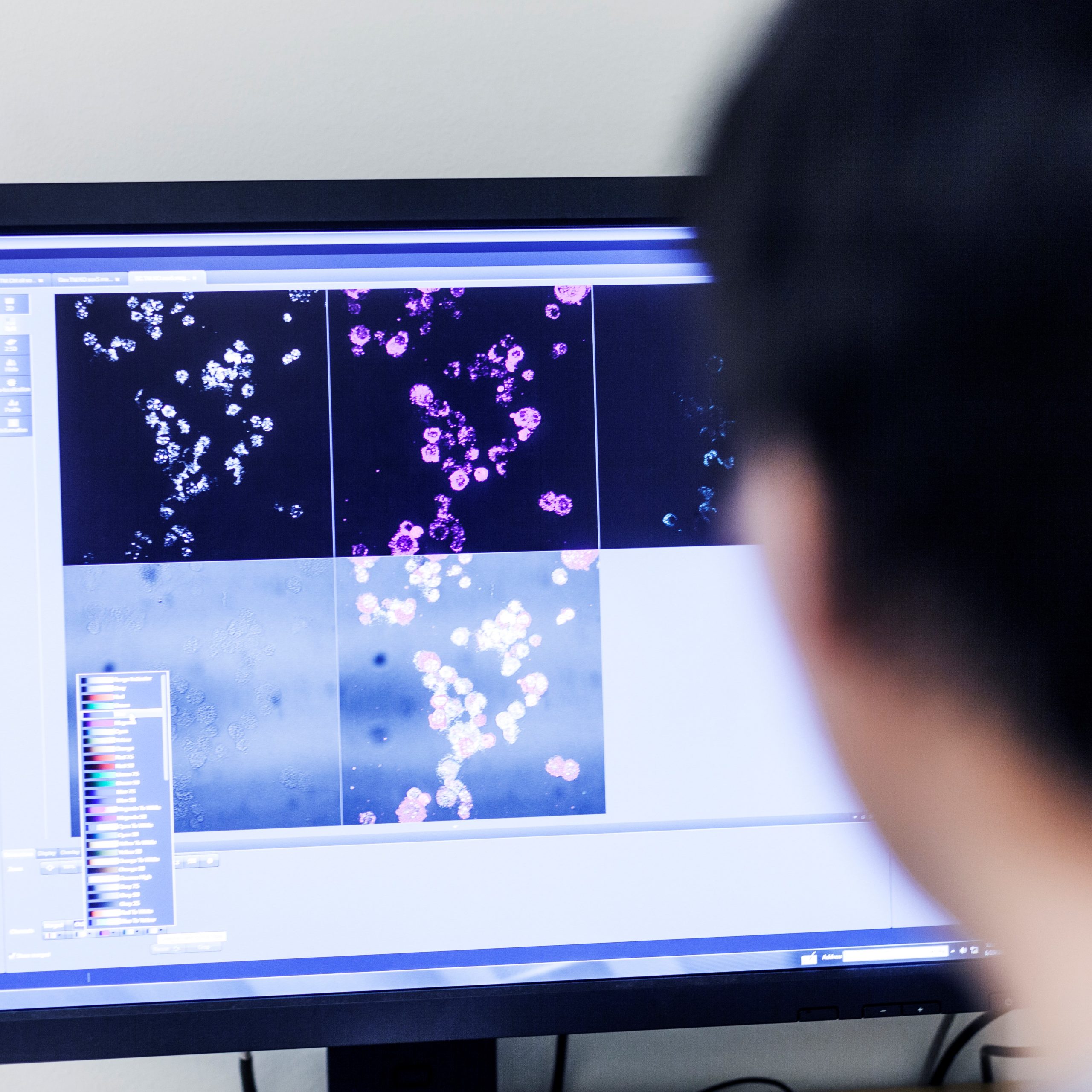 Cropped image of scientist using desktop PC in lab